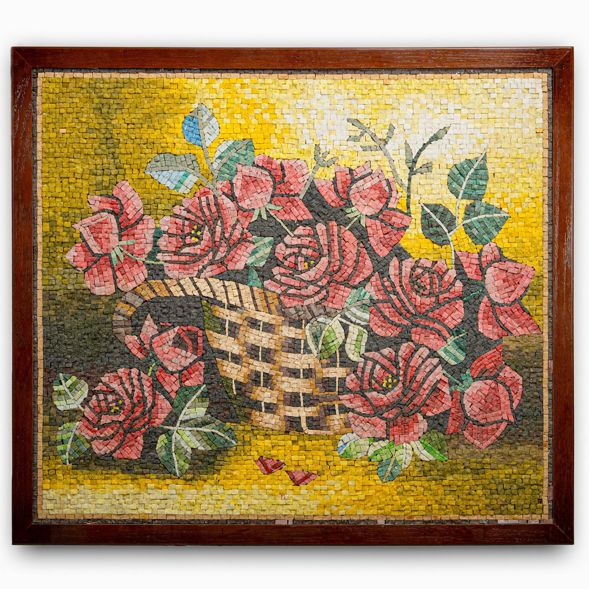 Intricate mosaic wall art featuring a basket of vibrant red roses against a warm yellow background — detailed craftsmanship showcases floral beauty.