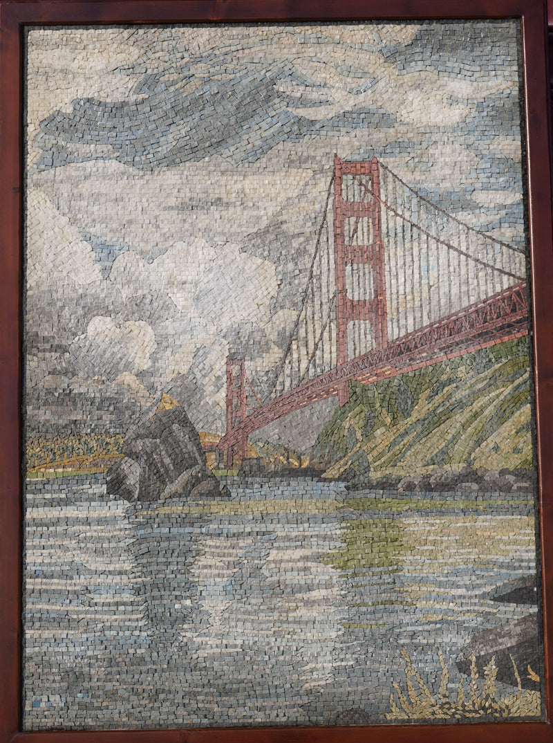 Intricate mosaic artwork depicting the Golden Gate Bridge in muted tones — textured stone pieces create a scenic waterfront view.