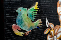 Colorful bird and lobster inlaid design on a black background — vibrant craftsmanship showcasing intricate detail.