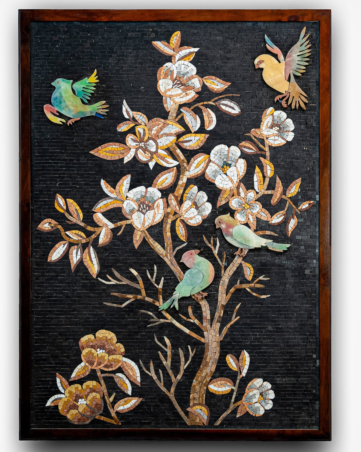 Intricate wall art featuring colorful birds and floral motifs on a dark background — handcrafted mosaic design with vibrant details