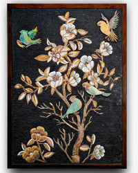 Intricate wall art featuring colorful birds and floral motifs on a dark background — handcrafted mosaic design with vibrant details
