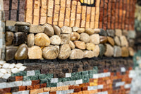 Intricate mosaic wall art featuring polished stones in earthy tones — a unique blend of texture and color.
