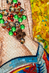 Intricate mosaic artwork featuring vibrant green, red, and gold tiles with textured surfaces and floral embellishments