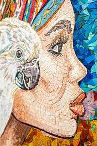Intricate mosaic artwork depicting a woman's profile with vibrant colors and a bird — showcasing detailed craftsmanship and texture.
