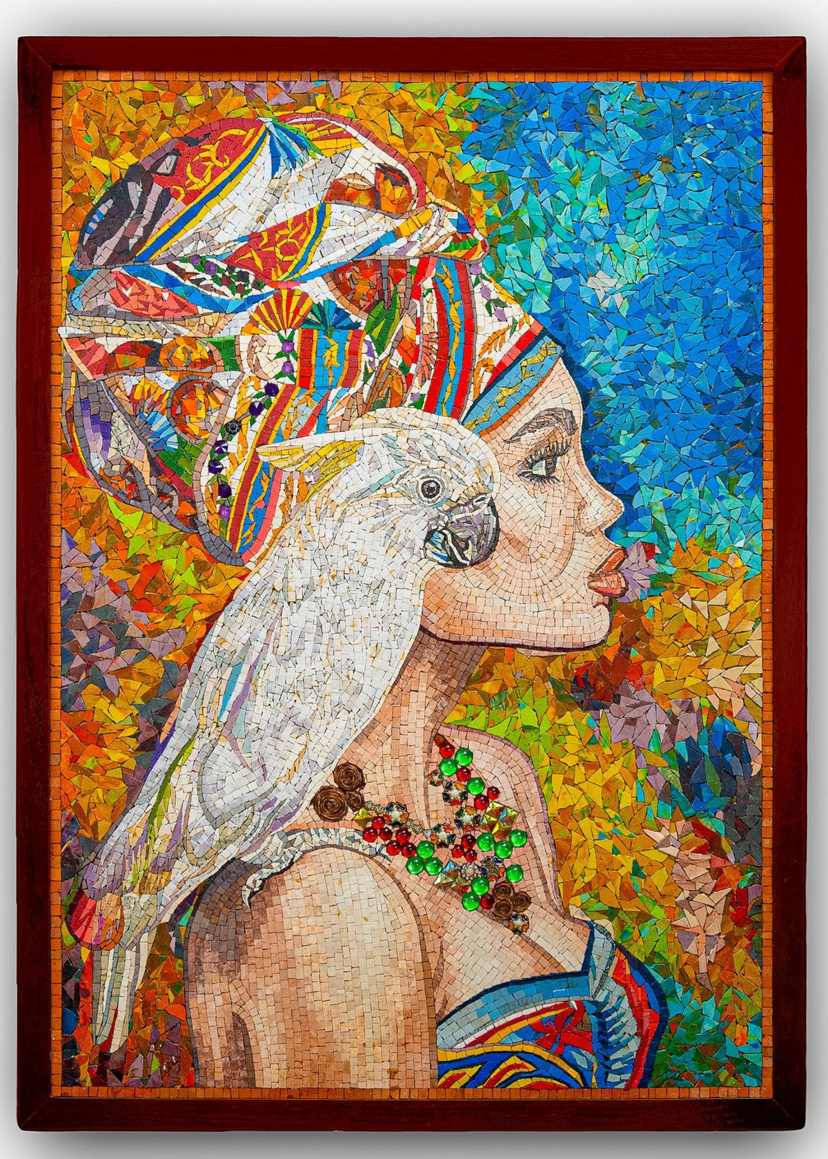 Vibrant mosaic artwork featuring a profile of a woman adorned with a colorful head wrap and a white parrot perched on her shoulder