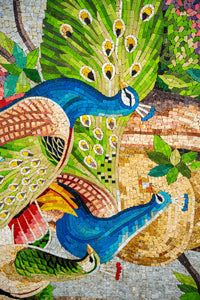 Vibrant mosaic featuring peacocks in blue and green hues — intricate tile work showcasing natural beauty and detail.