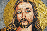 Intricate mosaic featuring a serene face with golden halo — vibrant tiles create a stunning religious artwork