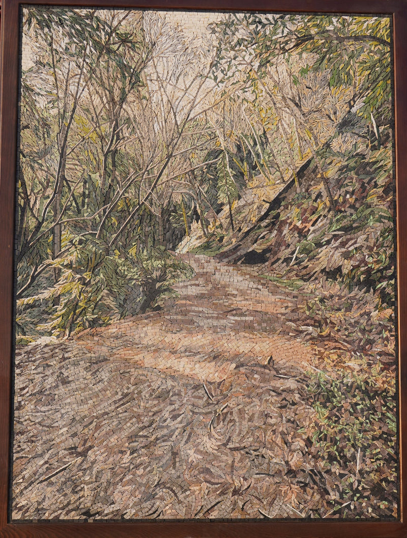 Intricate landscape puzzle depicting a serene forest path with textured pieces capturing natural light and earthy tones