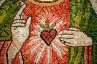 Intricate mosaic artwork featuring a heart surrounded by radiant rays — vibrant colors and textured tiles create depth.