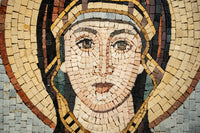 Intricate mosaic artwork depicting a serene figure with soft facial features and a golden halo, showcasing detailed craftsmanship.