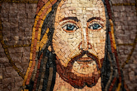 Intricate mosaic artwork depicting a serene figure with flowing hair and detailed facial features, showcasing rich earthy tones.