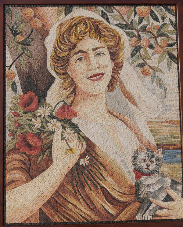 Vibrant mosaic artwork depicting a smiling woman with flowers and a cat, set against a rustic background of trees.