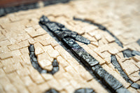 Intricate wooden puzzle pieces in natural tones create a tactile mosaic — featuring contrasting light and dark textures.