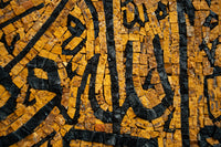 Intricate mosaic art featuring black and golden tiles — a striking blend of geometric patterns and textures.