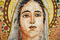 Intricate mosaic artwork featuring a serene face surrounded by vibrant colors and golden accents — a stunning example of craftsmanship.