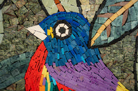 Vibrant mosaic art featuring a bird with rich blue and purple hues — intricate tile work showcasing detailed craftsmanship