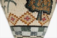 Intricate mosaic vase featuring a floral design in earthy tones — crafted with detailed tile work for a textured finish