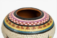 Intricately designed mosaic vase featuring vibrant colors and a smooth ceramic finish — perfect for showcasing floral arrangements.