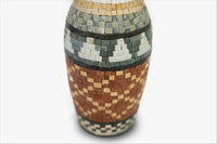 Intricate mosaic vase featuring earthy tones of terracotta and green — crafted with detailed tile work for a unique texture