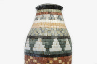 Artisan mosaic vase crafted from colorful stone tiles — a unique decorative piece with intricate geometric patterns.