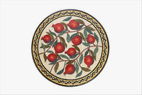 Intricate circular mosaic plate featuring vibrant red pomegranates and lush green leaves set against a cream background.