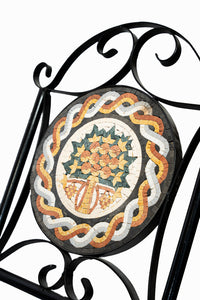 Intricate mosaic wall art featuring a vibrant tree design — set within a black wrought iron frame for added elegance.