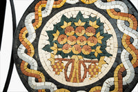 Intricate mosaic table featuring a floral design in earthy tones—crafted with precision from ceramic tiles.