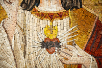 Intricate mosaic artwork depicting a heart with flames — vibrant earth tones create a striking visual contrast.
