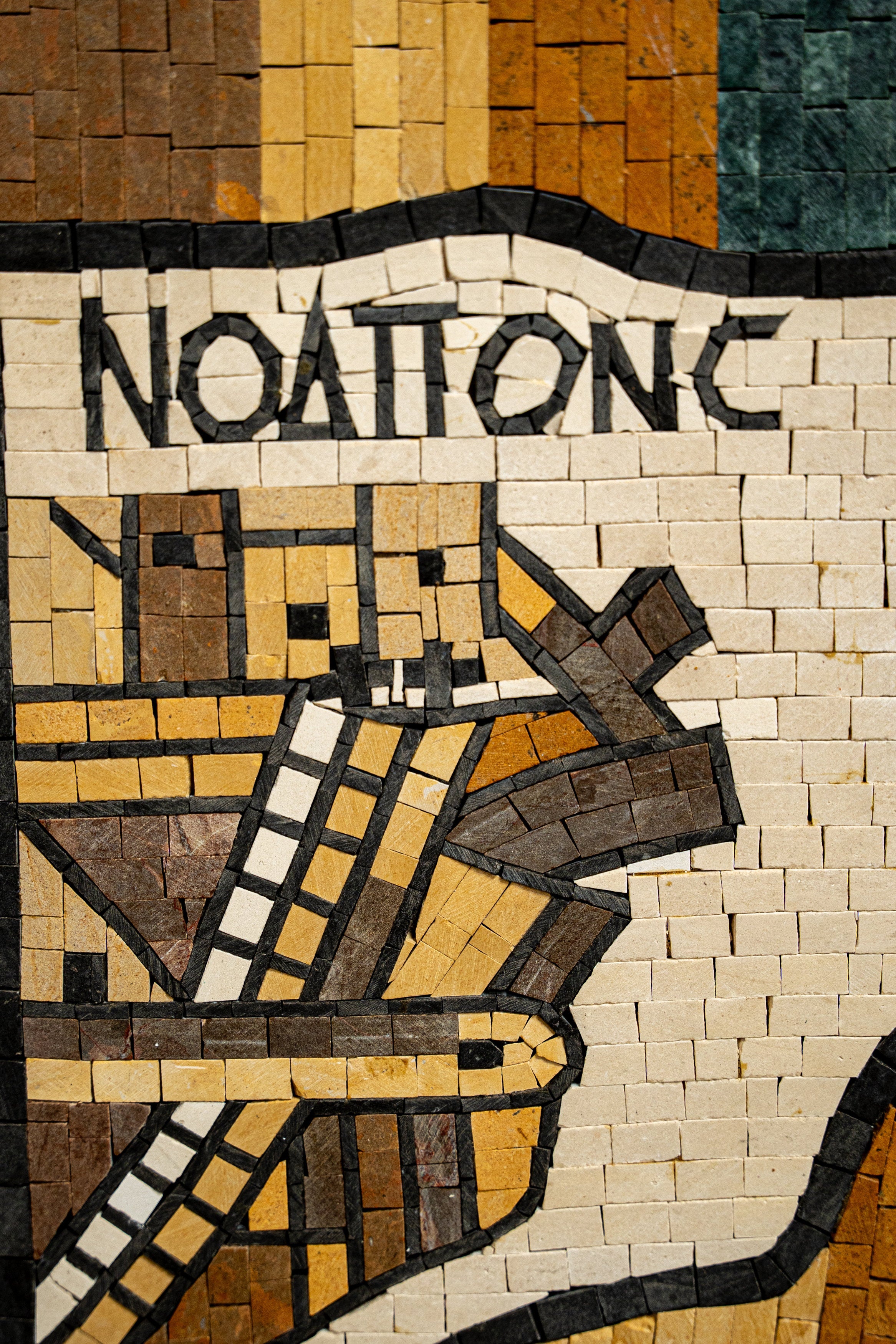 Intricate mosaic artwork featuring earthy tones and geometric patterns — a stunning representation of craftsmanship.