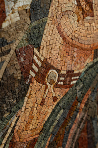 Intricate mosaic art featuring earthy tones and textured tiles — showcasing a detailed historical design.