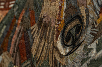 Intricate mosaic artwork featuring earthy tones and detailed textures, showcasing a spiral design in vibrant colors.