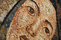 Intricate mosaic artwork showcasing earthy tones and detailed facial features — a stunning blend of craftsmanship and artistry.