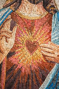 Intricate mosaic artwork featuring a heart surrounded by radiant beams — vibrant colors create a striking visual impact.