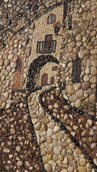 Intricate stone mosaic pathway featuring a charming archway design — earthy tones of pebbles create a textured visual appeal