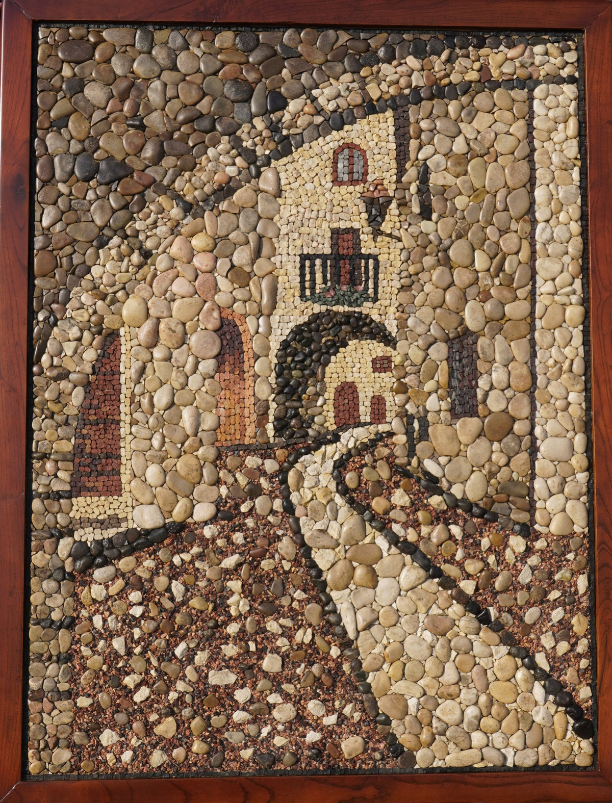 Intricate pebble mosaic artwork depicting a rustic archway with warm tones and detailed stone textures framed in wood