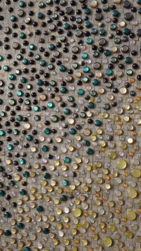 Intricate mosaic wall art featuring a blend of vibrant glass stones in various hues — an eye-catching decorative piece.
