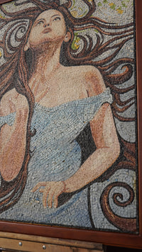 Intricate mosaic artwork featuring a woman in a flowing blue dress with detailed hair swirling around her face
