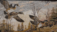 Intricate mosaic artwork depicting flying ducks against a serene forest backdrop — earthy tones with detailed textures
