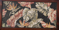 Intricate mosaic wall art featuring vibrant tropical leaves and flowers — a stunning blend of earthy tones and textures.
