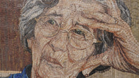 Intricate mosaic artwork depicting an elderly woman with glasses, showcasing detailed textures and warm earth tones.