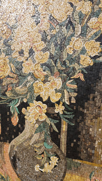 Intricate mosaic artwork featuring a floral arrangement in warm tones — detailed craftsmanship with textured tiles.