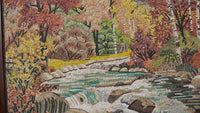 Vibrant mosaic artwork depicting a serene autumn landscape with flowing water and colorful foliage in rich textures.