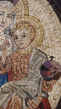 Intricate mosaic art depicting a child figure adorned with a colorful orb — crafted from varied natural stone tiles.