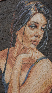 Intricate mosaic artwork depicting a thoughtful woman with flowing hair — crafted from colorful stone tiles for a stunning visual effect.