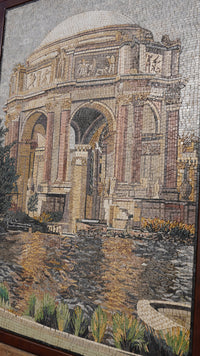 Intricate mosaic artwork depicting a grand architectural structure with textured stone details and vibrant greenery.