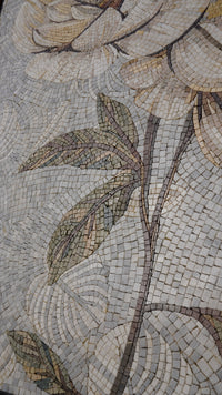 Intricate mosaic art featuring floral designs with muted earth tones and textured stone pieces creating a captivating pattern.