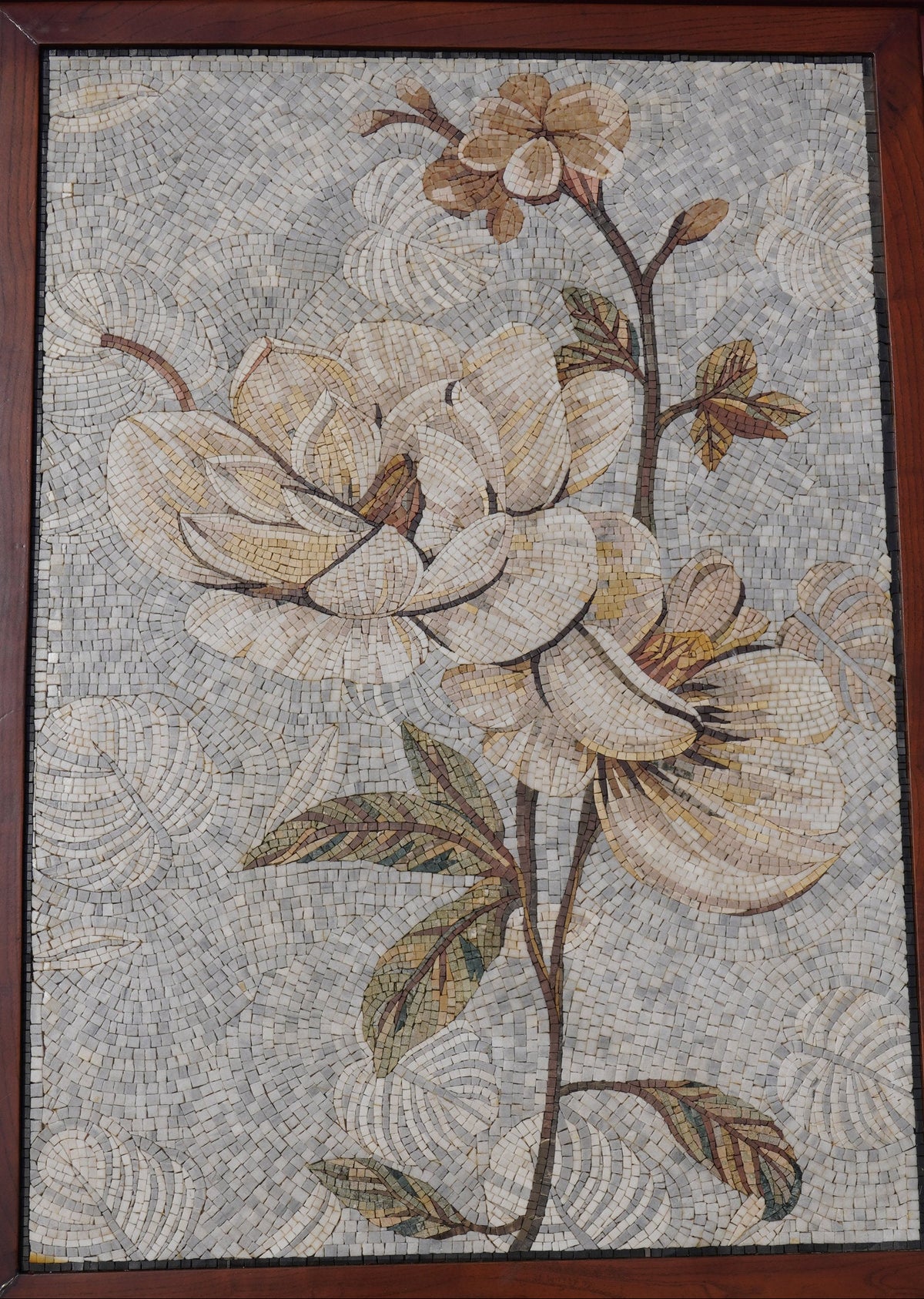 Intricate floral mosaic artwork featuring cream and beige magnolia flowers with detailed leaf patterns on a textured background