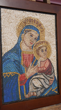 Intricate mosaic artwork depicting a serene mother and child in vibrant hues — crafted from natural stone tiles.