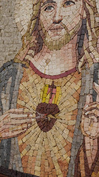 Intricate mosaic artwork depicting a sacred heart surrounded by colorful tiles — a striking blend of artistry and devotion.