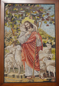 Intricate mosaic artwork depicting a shepherd in a red robe embracing a sheep against a pastoral background.